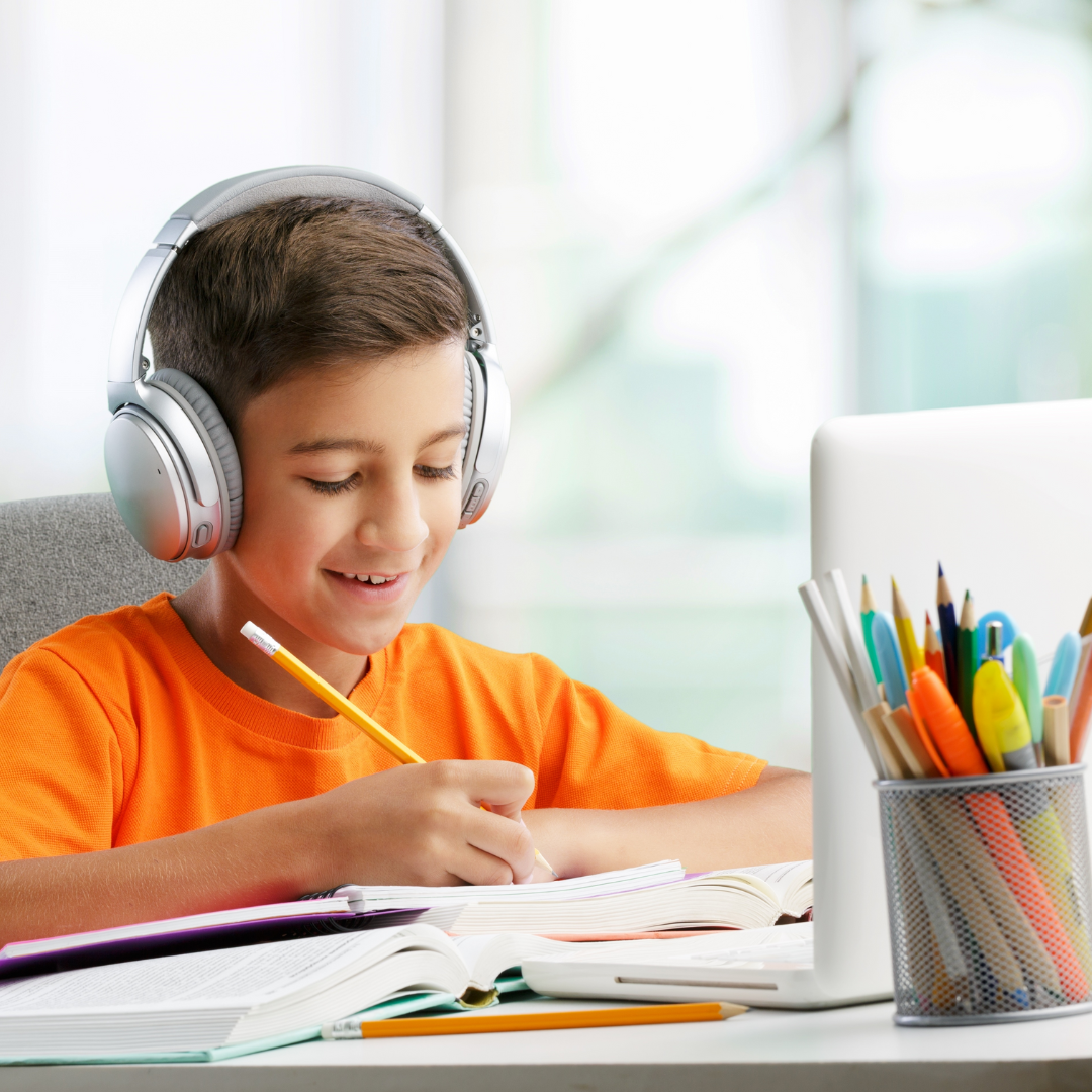 Boy on laptop with headphones